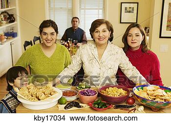 Stock Photo - family starting 
dinner. fotosearch 
- search stock 
photos, pictures, 
images, and photo 
clipart