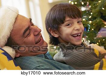 Stock Photography - father and son 
reading. fotosearch 
- search stock 
photos, pictures, 
images, and photo 
clipart