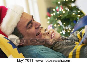 Stock Photography - father and son 
reading. fotosearch 
- search stock 
photos, pictures, 
images, and photo 
clipart
