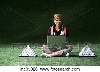 Stock Photo - female golfer 
typing on laptop. 
fotosearch - search 
stock photos, 
pictures, images, 
and photo clipart