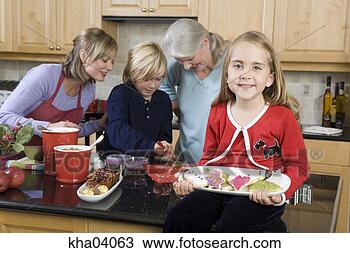 Stock Photo - girl holding christmas 
cookies. fotosearch 
- search stock 
photos, pictures, 
images, and photo 
clipart