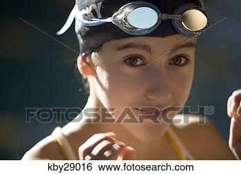 Stock Photo - girl wearing swimming 
cap and goggles. 
fotosearch - search 
stock photos, 
pictures, images, 
and photo clipart