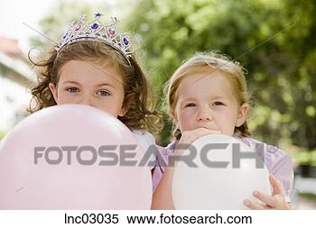 Stock Image - girls blowing 
up balloons. fotosearch 
- search stock 
photos, pictures, 
images, and photo 
clipart