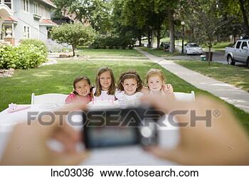 Stock Photo - girls having photograph 
taken. fotosearch 
- search stock 
photos, pictures, 
images, and photo 
clipart