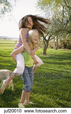 Stock Photography - girls playing 
in backyard. fotosearch 
- search stock 
photos, pictures, 
images, and photo 
clipart