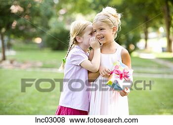 Stock Photo - girls telling 
secret. fotosearch 
- search stock 
photos, pictures, 
images, and photo 
clipart