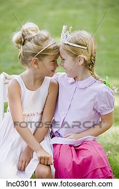 Stock Photography - girls touching 
foreheads. fotosearch 
- search stock 
photos, pictures, 
images, and photo 
clipart