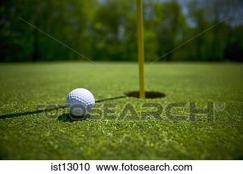 Stock Photography - golf ball near 
hole. fotosearch 
- search stock 
photos, pictures, 
images, and photo 
clipart