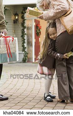 Stock Photo - granddaughter 
hugging arriving 
grandmother. fotosearch 
- search stock 
photos, pictures, 
images, and photo 
clipart