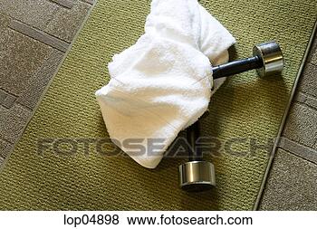 Stock Photo - hand weights and 
towel on mat. 
fotosearch - search 
stock photos, 
pictures, images, 
and photo clipart