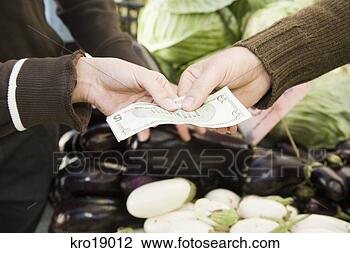 Stock Photo - hands exchanging 
money at vegetable 
stand. fotosearch 
- search stock 
photos, pictures, 
images, and photo 
clipart