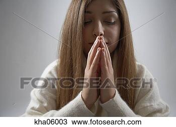 Stock Photo - hispanic woman 
praying. fotosearch 
- search stock 
photos, pictures, 
images, and photo 
clipart