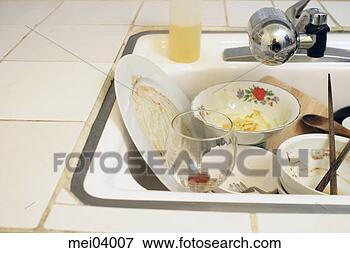 Picture - kitchen sink full 
of dirty dishes. 
fotosearch - search 
stock photos, 
pictures, images, 
and photo clipart