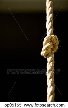 Stock Image - knot tied in rope 
climbing rope. 
fotosearch - search 
stock photos, 
pictures, images, 
and photo clipart