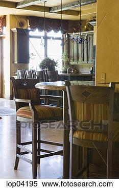 Stock Image - large comfortable 
bar stools in 
kitchen. fotosearch 
- search stock 
photos, pictures, 
images, and photo 
clipart