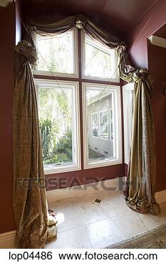 Stock Photo - large window with 
ornate curtains. 
fotosearch - search 
stock photos, 
pictures, images, 
and photo clipart