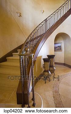 Stock Photo - long curving staircase 
and railing. fotosearch 
- search stock 
photos, pictures, 
images, and photo 
clipart