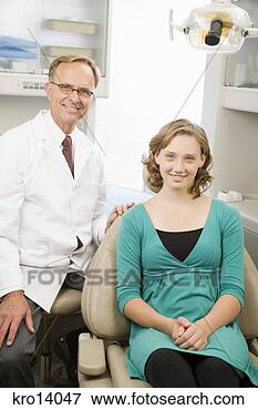 Picture - male dentist and 
girl in dental 
office. fotosearch 
- search stock 
photos, pictures, 
images, and photo 
clipart
