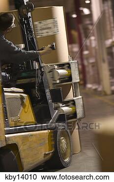 Stock Photography - man driving forklift 
in warehouse. 
fotosearch - search 
stock photos, 
pictures, images, 
and photo clipart