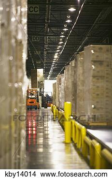 Stock Photo - man driving forklift 
in warehouse. 
fotosearch - search 
stock photos, 
pictures, images, 
and photo clipart