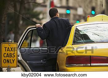 Stock Photo - man getting into 
taxi cab. fotosearch 
- search stock 
photos, pictures, 
images, and photo 
clipart