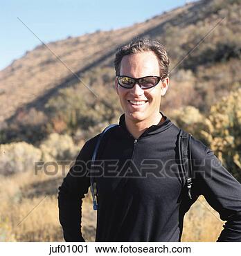 Stock Photography - man smiling in 
meadow. fotosearch 
- search stock 
photos, pictures, 
images, and photo 
clipart