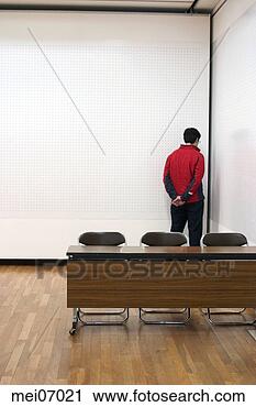 Stock Photography - man standing in 
corner of empty 
room. fotosearch 
- search stock 
photos, pictures, 
images, and photo 
clipart