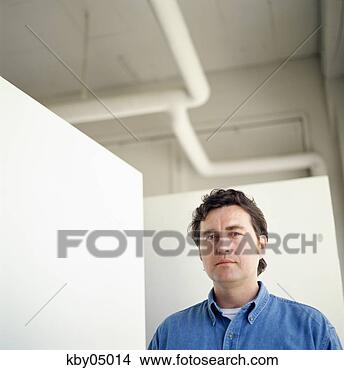 Stock Photo - man standing in 
white warehouse. 
fotosearch - search 
stock photos, 
pictures, images, 
and photo clipart