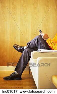 Picture - man text messaging. 
fotosearch - search 
stock photos, 
pictures, images, 
and photo clipart