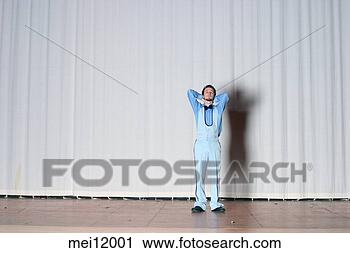 Stock Photography - man in tuxedo 
on stage. fotosearch 
- search stock 
photos, pictures, 
images, and photo 
clipart
