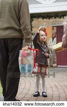 Stock Photo - man and woman 
arriving with 
christmas presents. 
fotosearch - search 
stock photos, 
pictures, images, 
and photo clipart
