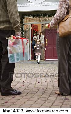 Stock Photo - man and woman 
arriving with 
christmas presents. 
fotosearch - search 
stock photos, 
pictures, images, 
and photo clipart