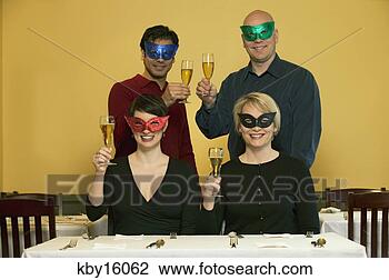 Stock Photo - masked people 
raising their 
champagne glasses. 
fotosearch - search 
stock photos, 
pictures, images, 
and photo clipart