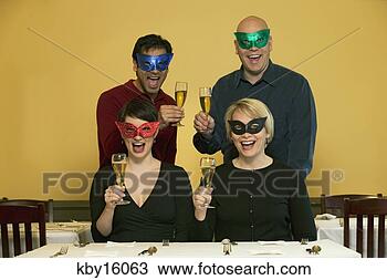 Stock Photo - masked people 
raising their 
champagne glasses. 
fotosearch - search 
stock photos, 
pictures, images, 
and photo clipart