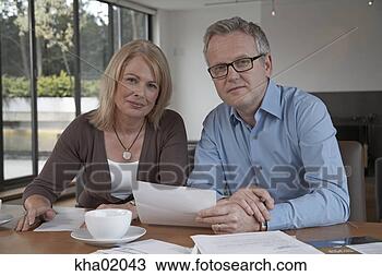 Stock Photo - mature couple 
reading mail. 
fotosearch - search 
stock photos, 
pictures, images, 
and photo clipart
