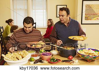 Stock Photo - men filling dinner 
plates. fotosearch 
- search stock 
photos, pictures, 
images, and photo 
clipart