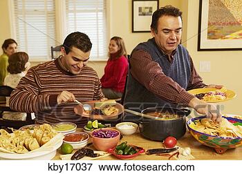 Picture - men filling dinner 
plates. fotosearch 
- search stock 
photos, pictures, 
images, and photo 
clipart