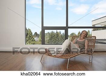Stock Photo - middle-aged woman 
sleeping and listening 
to music. fotosearch 
- search stock 
photos, pictures, 
images, and photo 
clipart