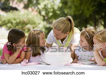 Picture - mother holding 
daughter’s birthday 
cake. fotosearch 
- search stock 
photos, pictures, 
images, and photo 
clipart