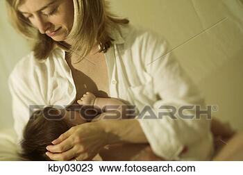 Stock Photo - mother nursing 
newborn. fotosearch 
- search stock 
photos, pictures, 
images, and photo 
clipart