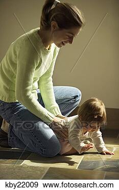Stock Photograph - mother playing 
with baby daughter. 
fotosearch - search 
stock photos, 
pictures, images, 
and photo clipart