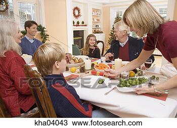 Stock Photo - mother serving 
son brussels sprouts 
at christmas dinner. 
fotosearch - search 
stock photos, 
pictures, images, 
and photo clipart