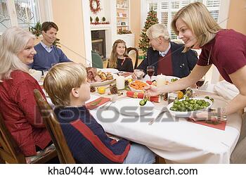 Stock Photo - mother serving 
son brussels sprouts 
at christmas dinner. 
fotosearch - search 
stock photos, 
pictures, images, 
and photo clipart