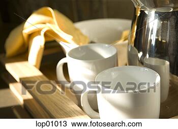 Stock Photo - mugs and metal 
pitcher on tray. 
fotosearch - search 
stock photos, 
pictures, images, 
and photo clipart