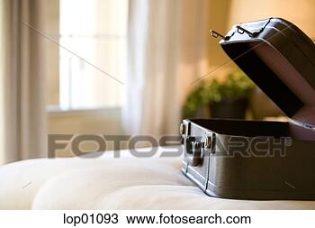Stock Photo - open suitcase 
on bed. fotosearch 
- search stock 
photos, pictures, 
images, and photo 
clipart