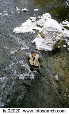 Stock Photography - overhead view 
of fly fisherman 
casting in stream. 
fotosearch - search 
stock photos, 
pictures, images, 
and photo clipart
