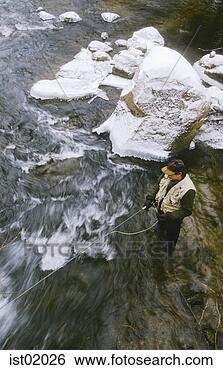Stock Photo - overhead view 
of fly fisherman 
casting in stream. 
fotosearch - search 
stock photos, 
pictures, images, 
and photo clipart