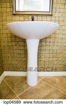 Stock Photograph - pedestal sink 
in rustic tiled 
bathroom. fotosearch 
- search stock 
photos, pictures, 
images, and photo 
clipart
