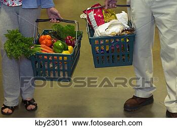 Stock Photography - people holding 
grocery baskets. 
fotosearch - search 
stock photos, 
pictures, images, 
and photo clipart