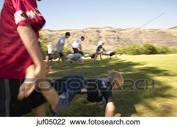 Stock Photo - people participating 
in wheelbarrow 
race. fotosearch 
- search stock 
photos, pictures, 
images, and photo 
clipart